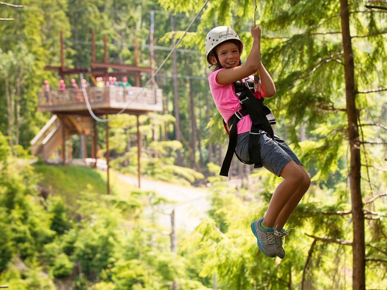A girl enjoys her ziplining tour in Warrenton