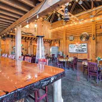 a group of people sitting at a table in front of a building