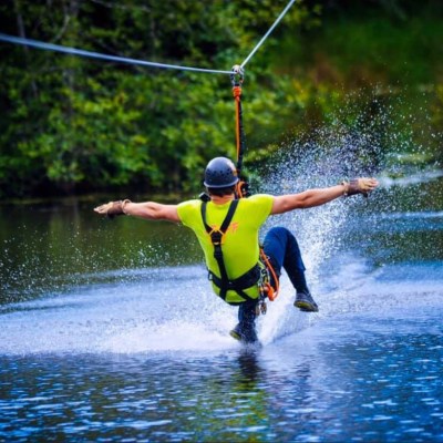 a man water skiing on a lake